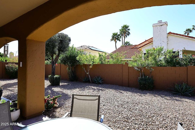 view of yard featuring a patio area and a fenced backyard