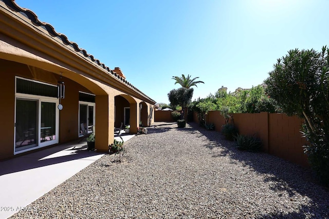 view of yard featuring a fenced backyard and a patio