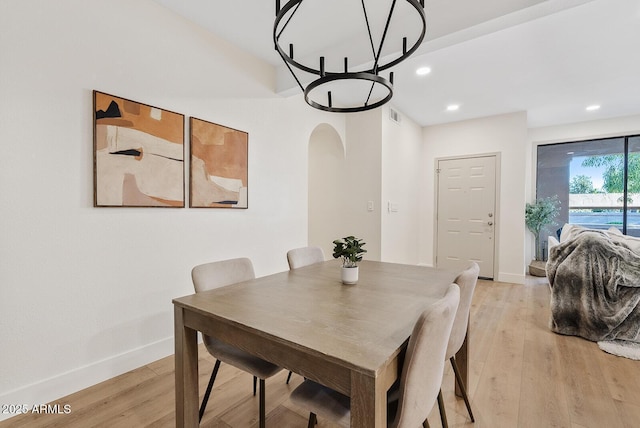9708 E Via Linda Rd Unit 1350, Scottsdale, AZ 85258 - dining space with a chandelier, arched walkways, light wood-style flooring, baseboards, and recessed lighting