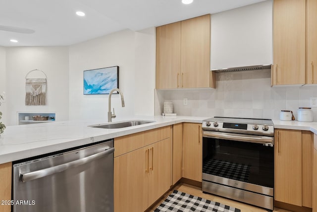 9708 E Via Linda Rd Unit 1350, Scottsdale, AZ 85258 - kitchen featuring stainless steel appliances, a sink, light brown cabinets, decorative backsplash, and recessed lighting