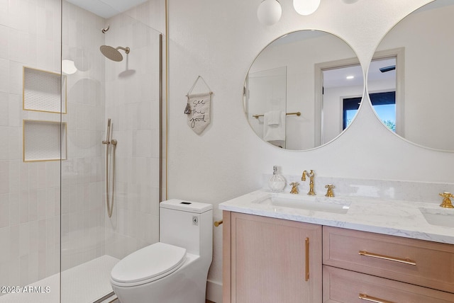 9708 E Via Linda Rd Unit 1350, Scottsdale, AZ 85258 - bathroom featuring toilet, a tile shower, and double vanity