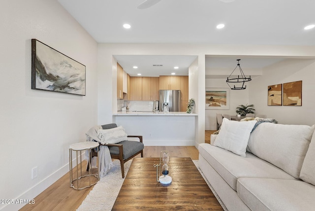 9708 E Via Linda Rd Unit 1350, Scottsdale, AZ 85258 - living room featuring light wood-style flooring, recessed lighting, and baseboards