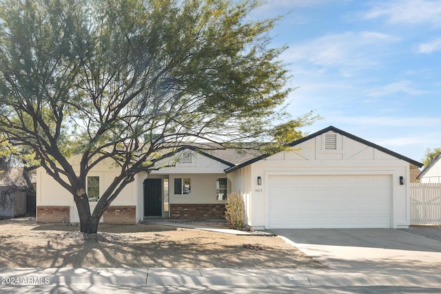 single story home featuring a garage