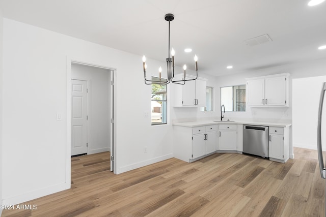 kitchen featuring sink, white cabinets, dishwasher, and light hardwood / wood-style floors