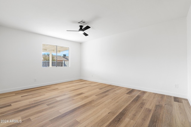 empty room with light hardwood / wood-style floors and ceiling fan