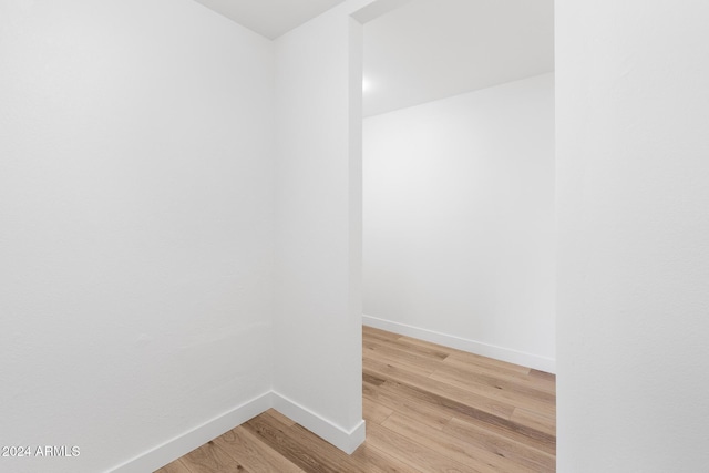 spare room featuring wood-type flooring