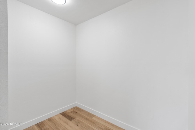 unfurnished room featuring wood-type flooring