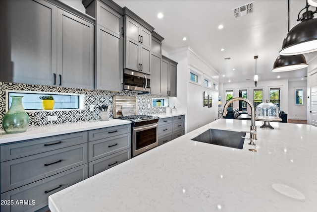 306 W Culver St, Phoenix, AZ 85003 - kitchen featuring gray cabinetry, stainless steel appliances, a sink, recessed lighting, and backsplash