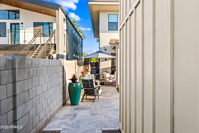 306 W Culver St, Phoenix, AZ 85003 - view of side of home with a patio, fence, and stucco siding