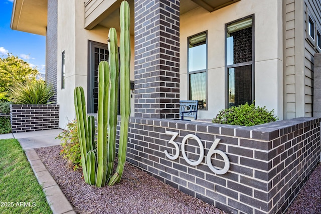 306 W Culver St, Phoenix, AZ 85003 - view of exterior entry with stucco siding and brick siding