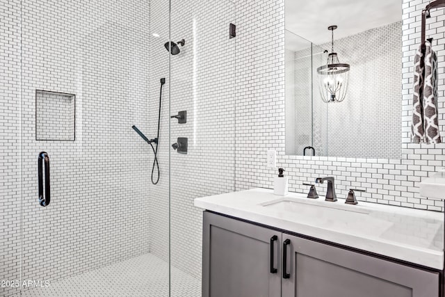 306 W Culver St, Phoenix, AZ 85003 - bathroom with tile walls, a shower stall, vanity, and tasteful backsplash