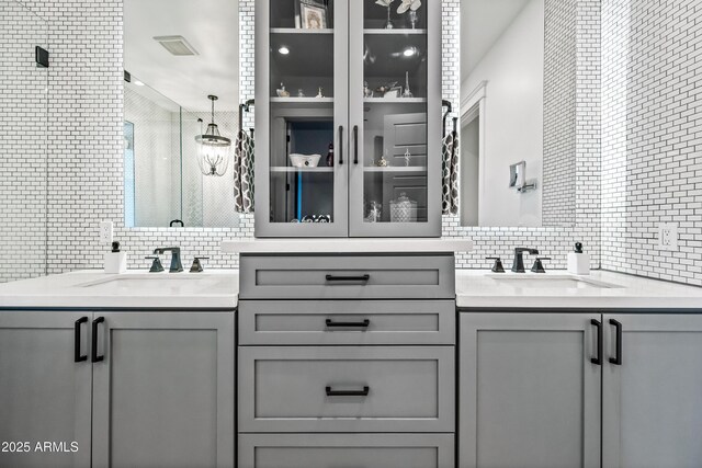 306 W Culver St, Phoenix, AZ 85003 - full bathroom featuring decorative backsplash, a stall shower, vanity, and tile walls