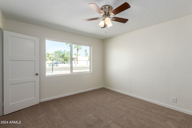 carpeted empty room with ceiling fan