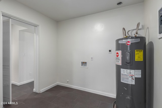 utility room featuring water heater