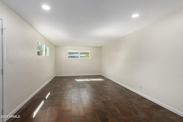 unfurnished room featuring dark wood-type flooring