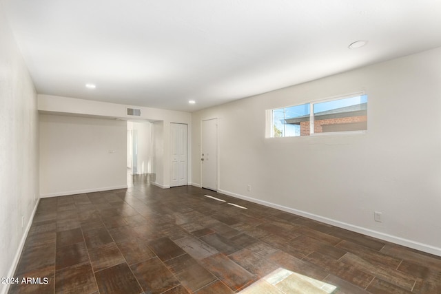 empty room featuring dark hardwood / wood-style floors