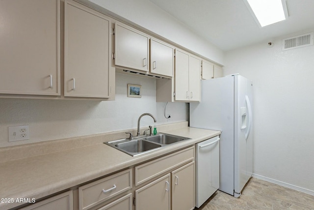 kitchen with white dishwasher and sink