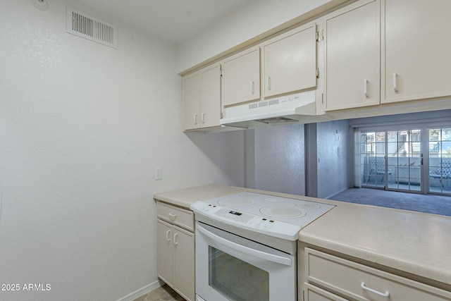 kitchen with white cabinetry and white range with electric stovetop