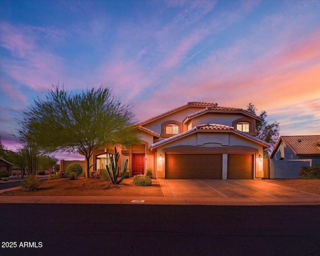 4402 E Barwick Dr, Cave Creek, AZ 85331 - mediterranean / spanish home featuring concrete driveway, a garage, stucco siding, and a tile roof