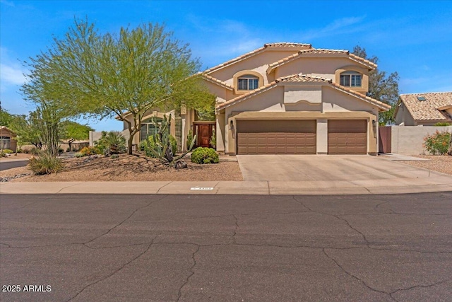 4402 E Barwick Dr, Cave Creek, AZ 85331 - mediterranean / spanish house featuring a garage, stucco siding, concrete driveway, and a tiled roof