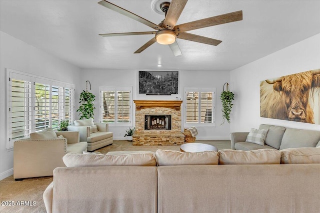 4402 E Barwick Dr, Cave Creek, AZ 85331 - living room with light carpet, a ceiling fan, and a fireplace