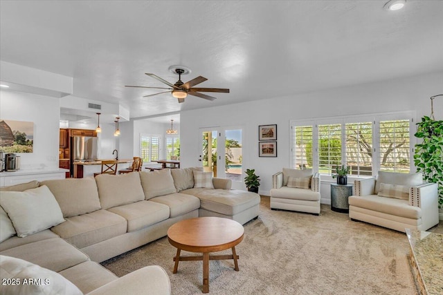 4402 E Barwick Dr, Cave Creek, AZ 85331 - living area featuring light colored carpet, ceiling fan, and recessed lighting