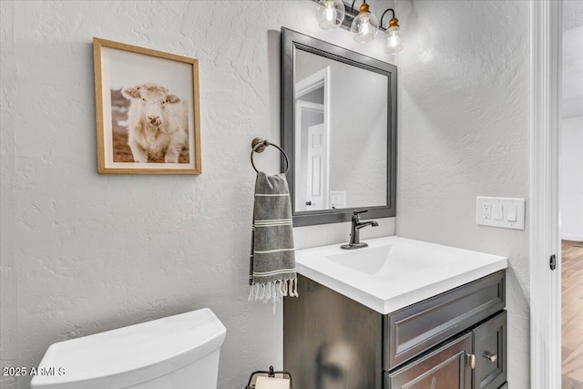 4402 E Barwick Dr, Cave Creek, AZ 85331 - half bath featuring vanity, a textured wall, and wood finished floors