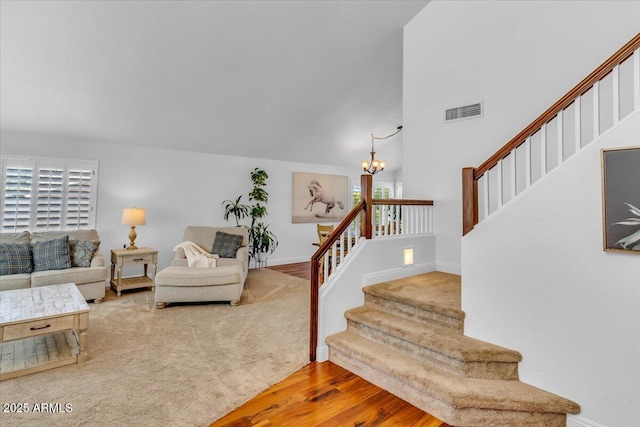4402 E Barwick Dr, Cave Creek, AZ 85331 - staircase with a chandelier, wood finished floors, and a high ceiling