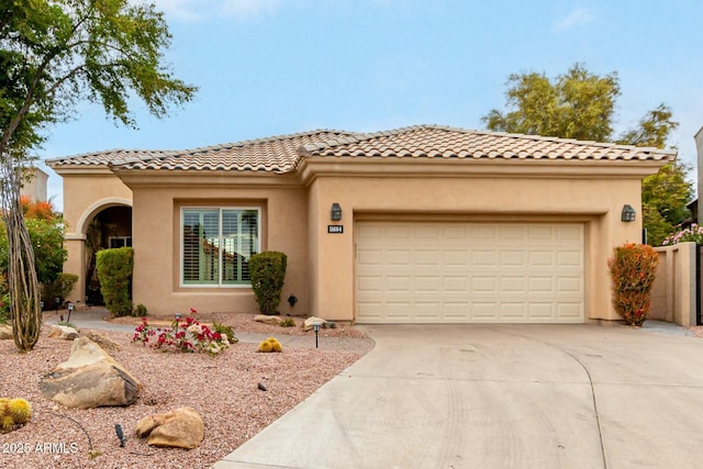 mediterranean / spanish home with a garage