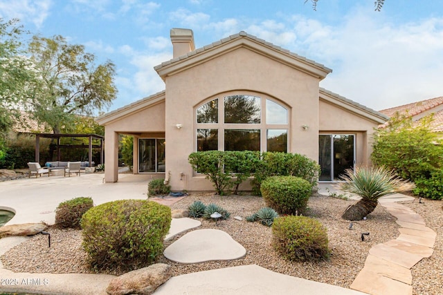 rear view of house with a patio area