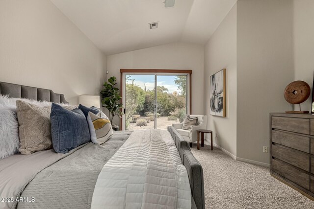 carpeted bedroom with access to exterior and vaulted ceiling