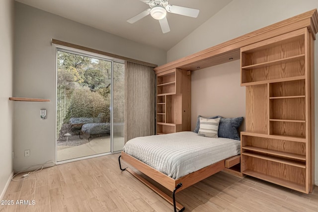 bedroom with access to exterior, vaulted ceiling, light hardwood / wood-style flooring, and ceiling fan