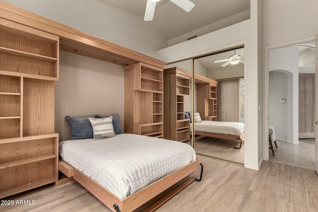 bedroom featuring hardwood / wood-style flooring, a closet, and ceiling fan