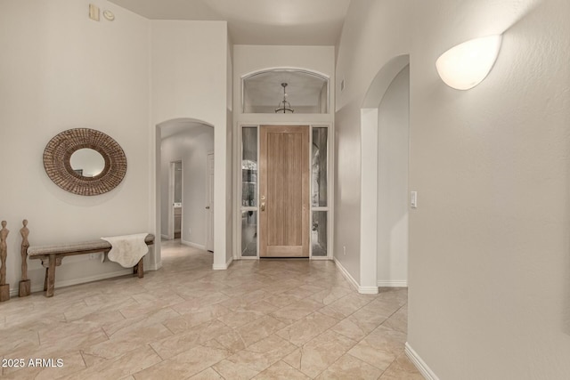 foyer with a towering ceiling