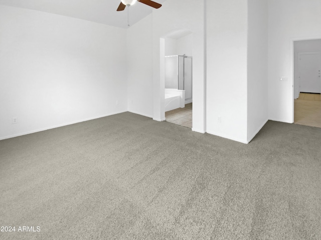 carpeted empty room featuring ceiling fan