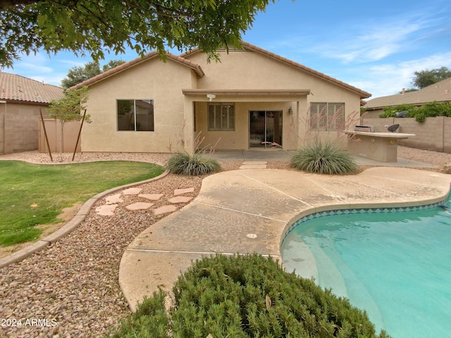 rear view of house with a patio