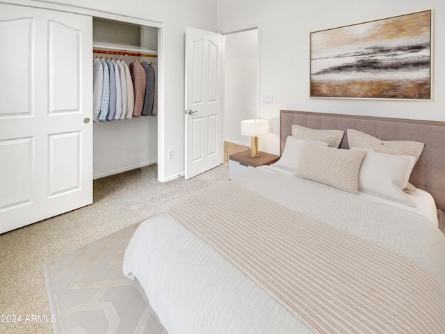 bedroom featuring light carpet and a closet