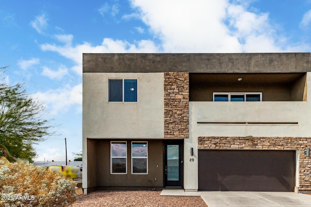 2000 N 36th St Unit 29, Phoenix, AZ 85008 - contemporary home featuring an attached garage, concrete driveway, stone siding, and stucco siding