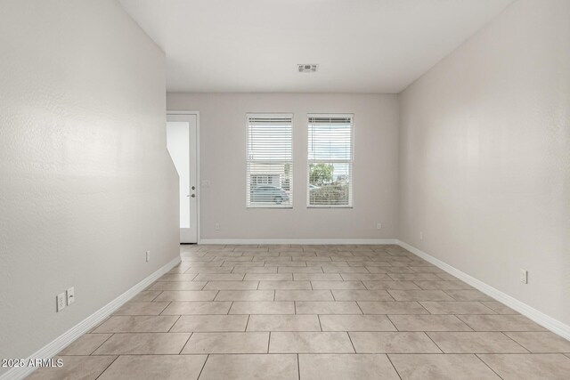 2000 N 36th St Unit 29, Phoenix, AZ 85008 - empty room featuring baseboards and light tile patterned floors