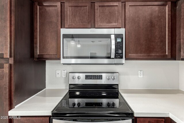 2000 N 36th St Unit 29, Phoenix, AZ 85008 - kitchen with stainless steel appliances, light countertops, and dark brown cabinetry