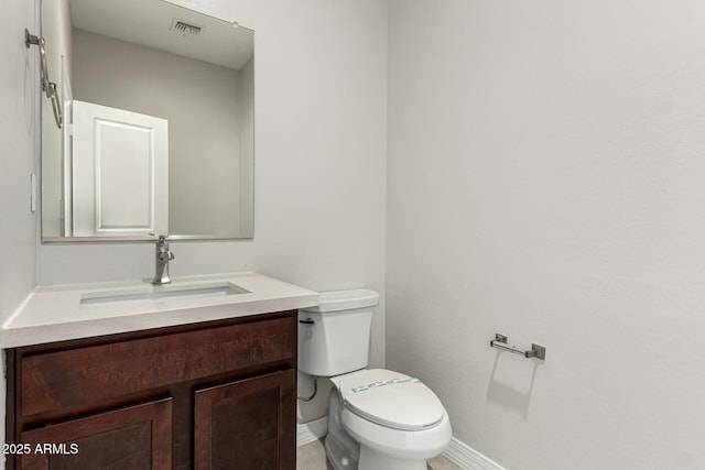 2000 N 36th St Unit 29, Phoenix, AZ 85008 - bathroom featuring baseboards, toilet, and vanity