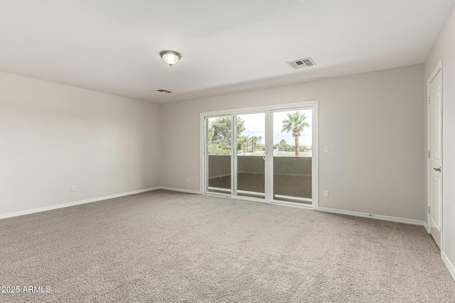 2000 N 36th St Unit 29, Phoenix, AZ 85008 - spare room featuring carpet and baseboards