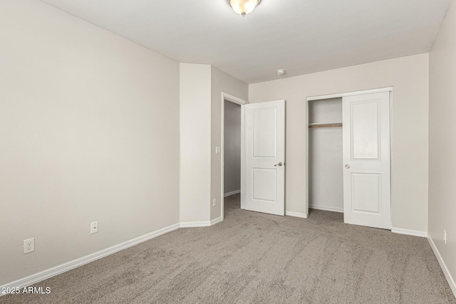 2000 N 36th St Unit 29, Phoenix, AZ 85008 - unfurnished bedroom with carpet floors, a closet, and baseboards