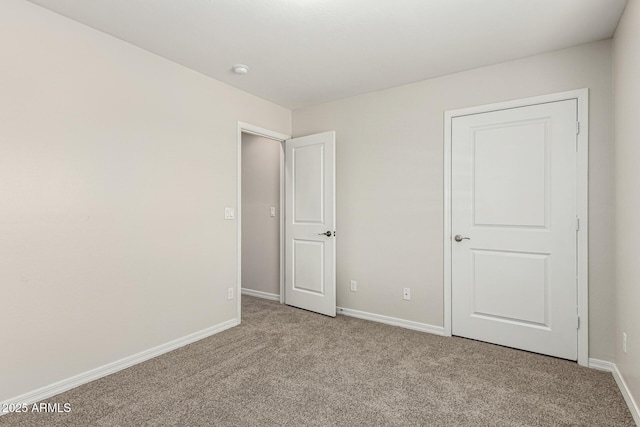 2000 N 36th St Unit 29, Phoenix, AZ 85008 - unfurnished bedroom with carpet flooring and baseboards