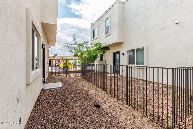 2000 N 36th St Unit 29, Phoenix, AZ 85008 - view of side of property with fence, stucco siding, and a playground