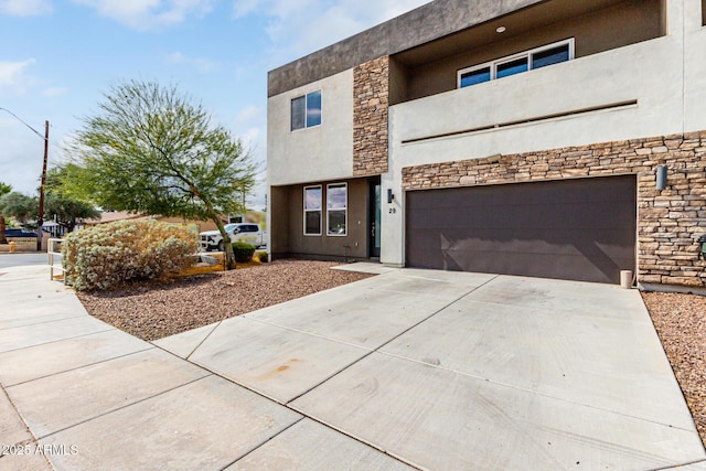 2000 N 36th St Unit 29, Phoenix, AZ 85008 - view of front of property with stone siding, an attached garage, driveway, and stucco siding