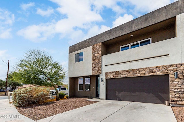 2000 N 36th St Unit 29, Phoenix, AZ 85008 - contemporary home featuring stone siding, an attached garage, concrete driveway, and stucco siding