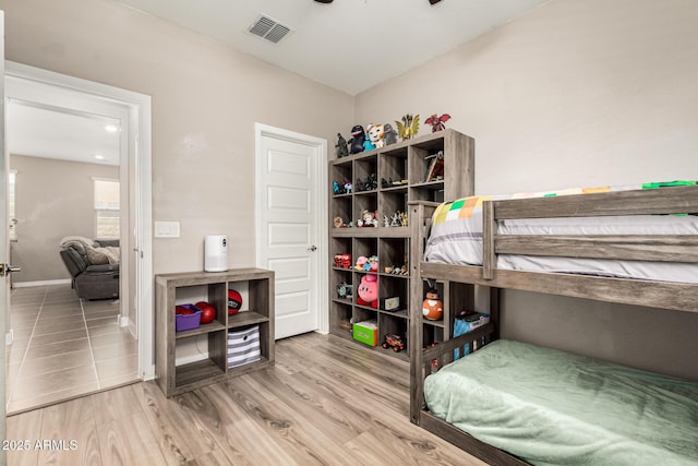 19920 W Monterosa St, Litchfield Park, AZ 85340 - bedroom featuring visible vents, baseboards, and wood finished floors