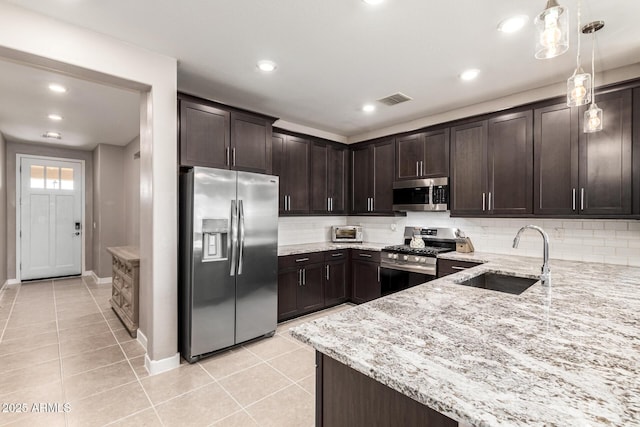 19920 W Monterosa St, Litchfield Park, AZ 85340 - kitchen featuring dark brown cabinets and appliances with stainless steel finishes