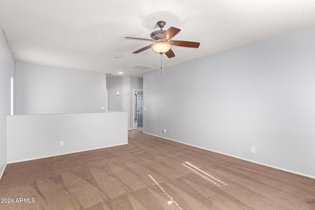 carpeted empty room featuring ceiling fan